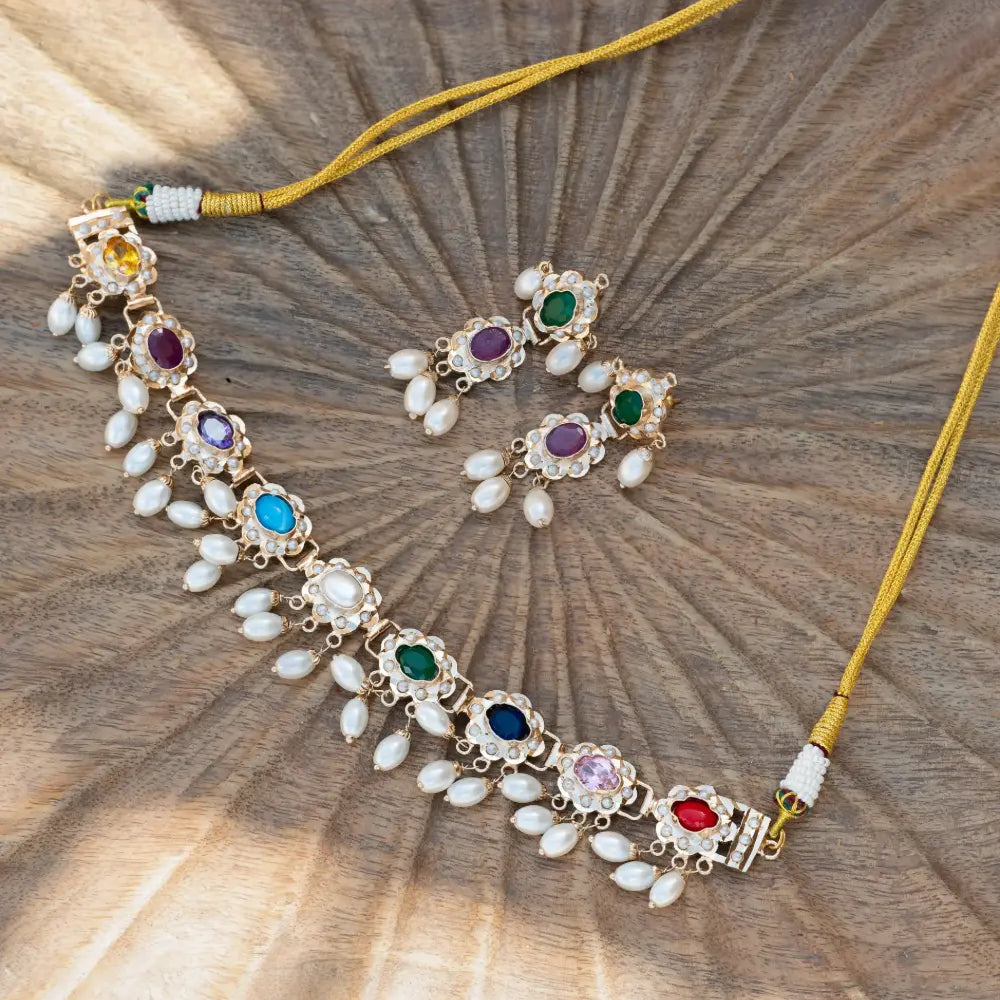 
                      
                        Navratan Jadau Necklace Set
                      
                    